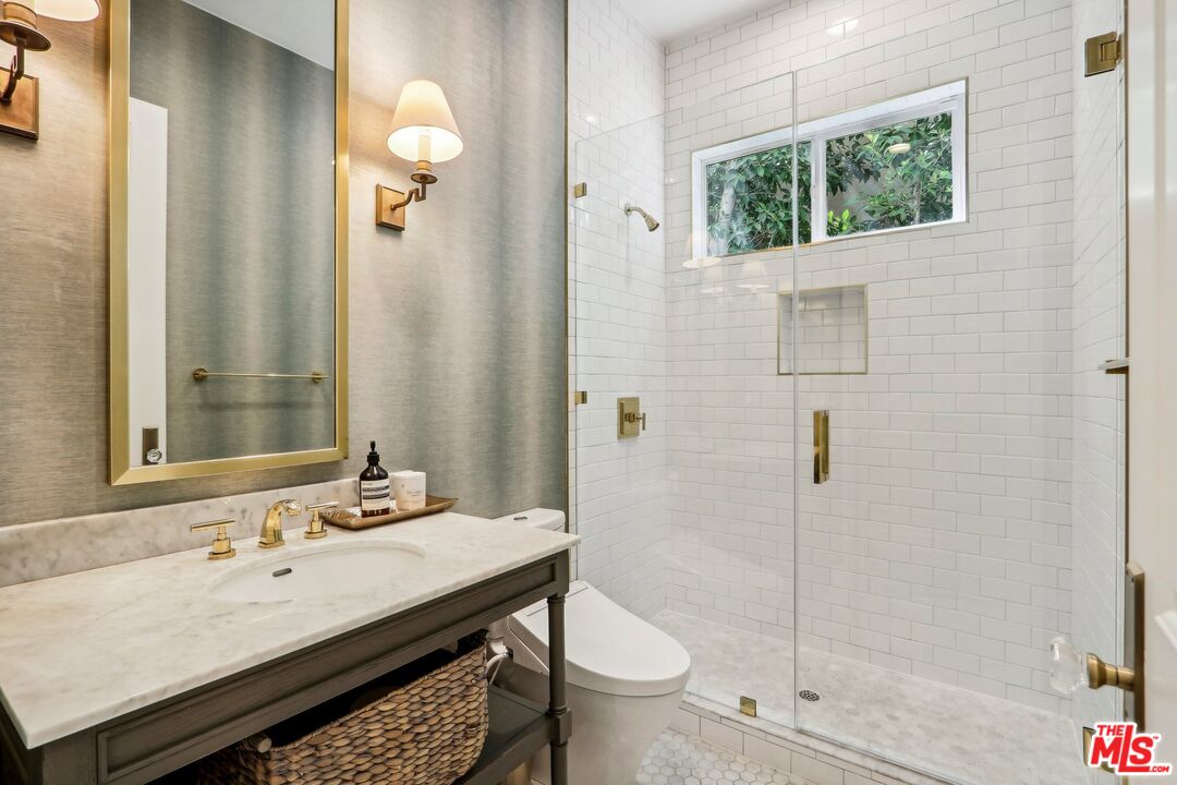 14000 Morrison Street Sherman Oaks, CA 91423 - Photo 14 of 34 a bathroom with a sink a toilet and shower