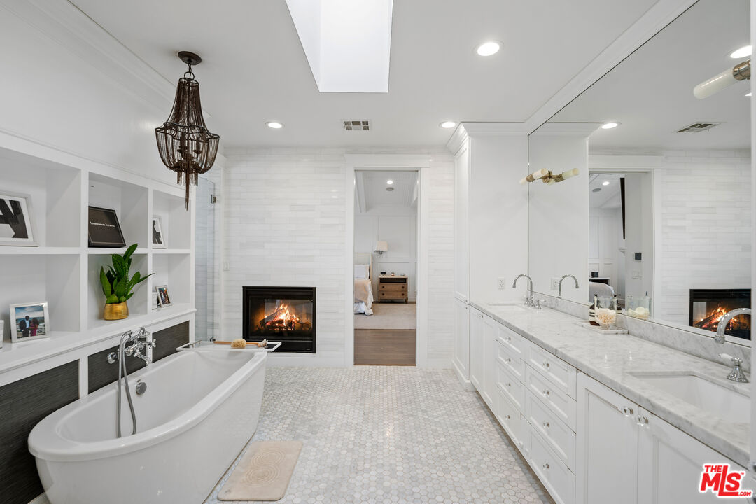 14000 Morrison Street Sherman Oaks, CA 91423 - Photo 22 of 34 a spacious bathroom with a double sink and a bathtub
