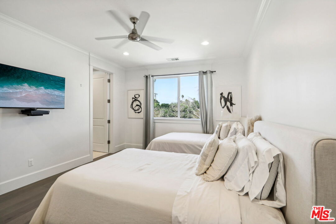 14000 Morrison Street Sherman Oaks, CA 91423 - Photo 29 of 34 a bedroom with a bed and a flat screen tv