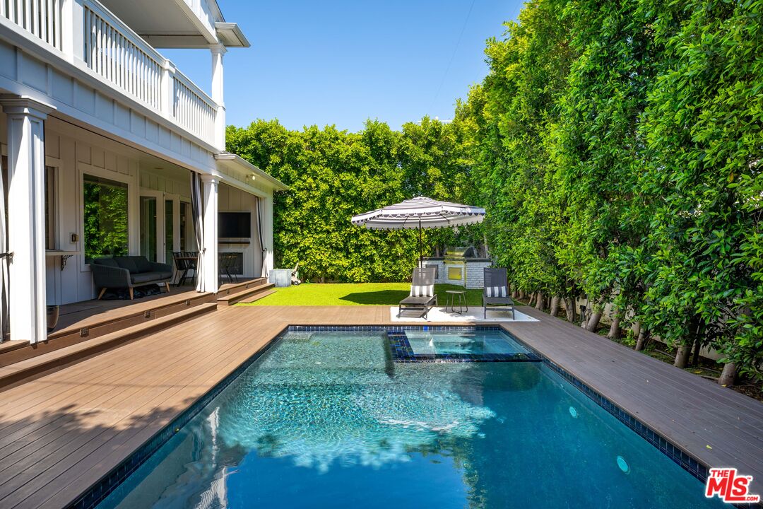 14000 Morrison Street Sherman Oaks, CA 91423 - Photo 33 of 34 a view of a swimming pool with a patio