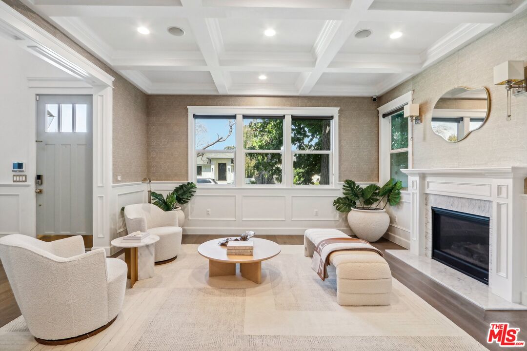 14000 Morrison Street Sherman Oaks, CA 91423 - Photo 4 of 34 a living room with furniture a window and a fireplace