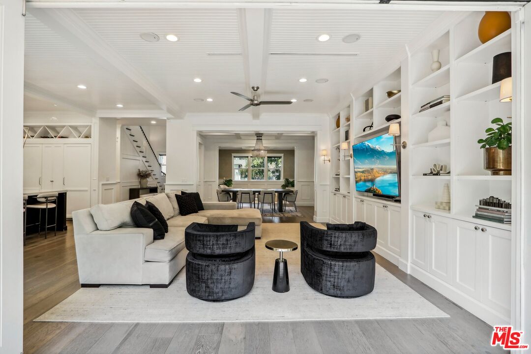 14000 Morrison Street Sherman Oaks, CA 91423 - Photo 9 of 34 a living room with lots of furniture and a painting on the wall