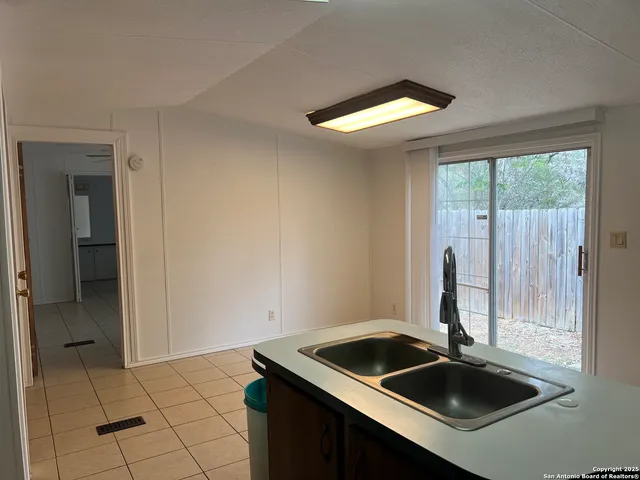 a kitchen that has a sink and a window