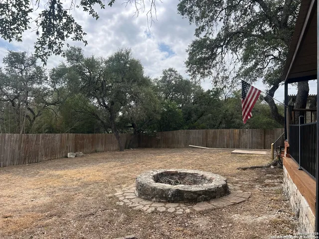 a swimming pool with wooden fence