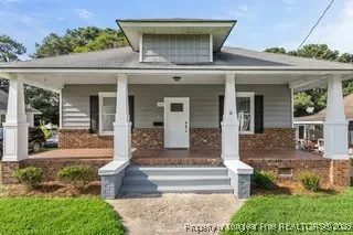 front view of a house with a fountain