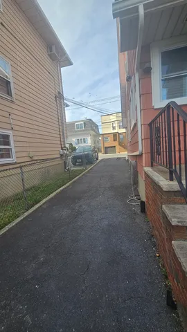 a view of a house with backyard and porch