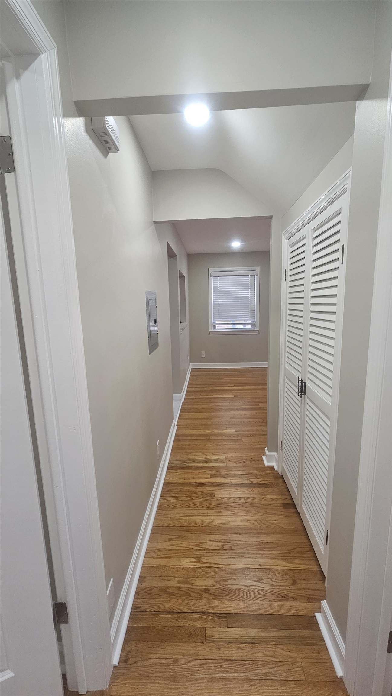 736 3rd Street, Unit 1 Secaucus, NJ 07094 - Photo 7 of 15 a view of a hallway with wooden floor and a bathroom