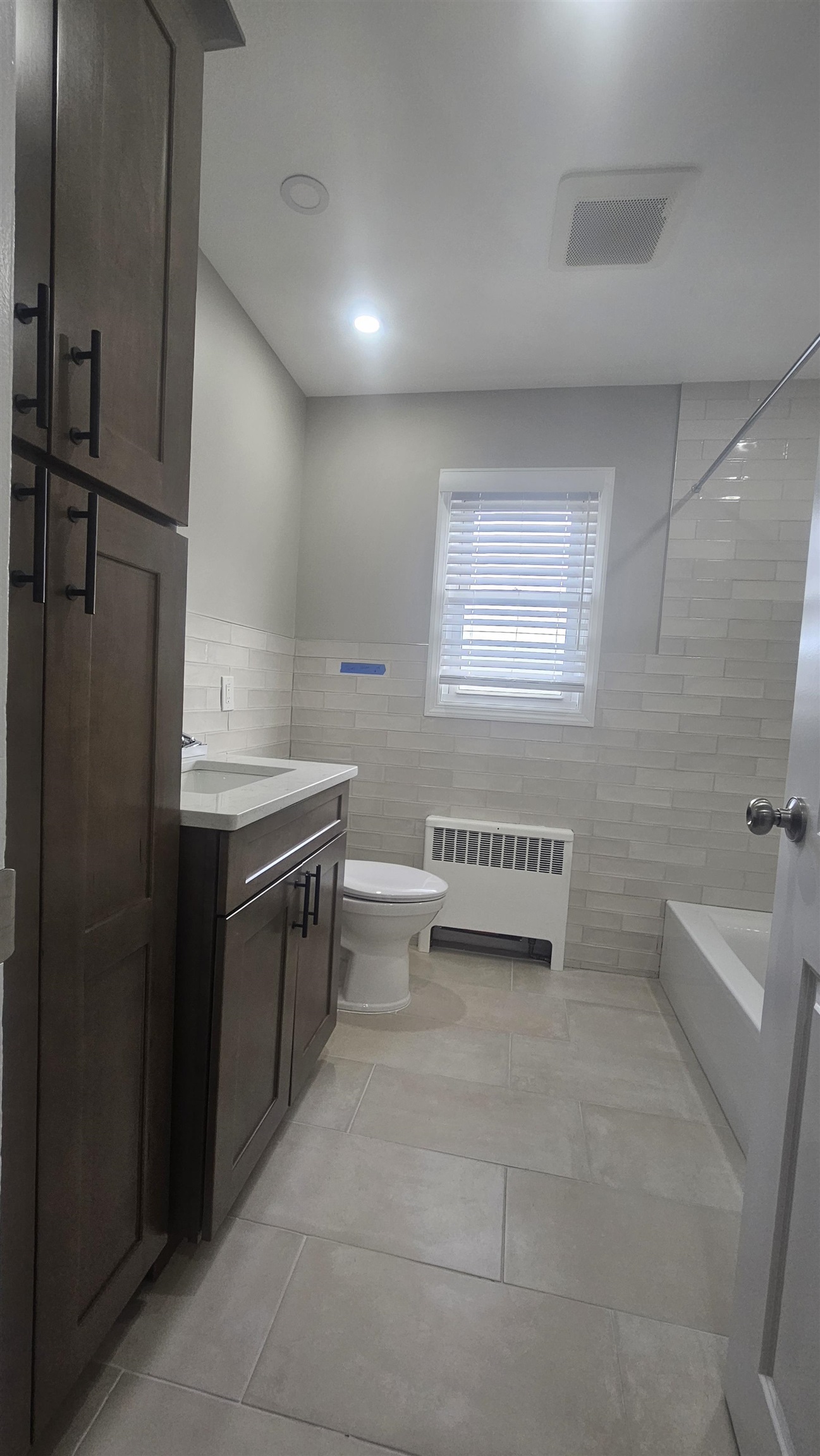 736 3rd Street, Unit 1 Secaucus, NJ 07094 - Photo 8 of 15 a bathroom with a sink a toilet and bathtub