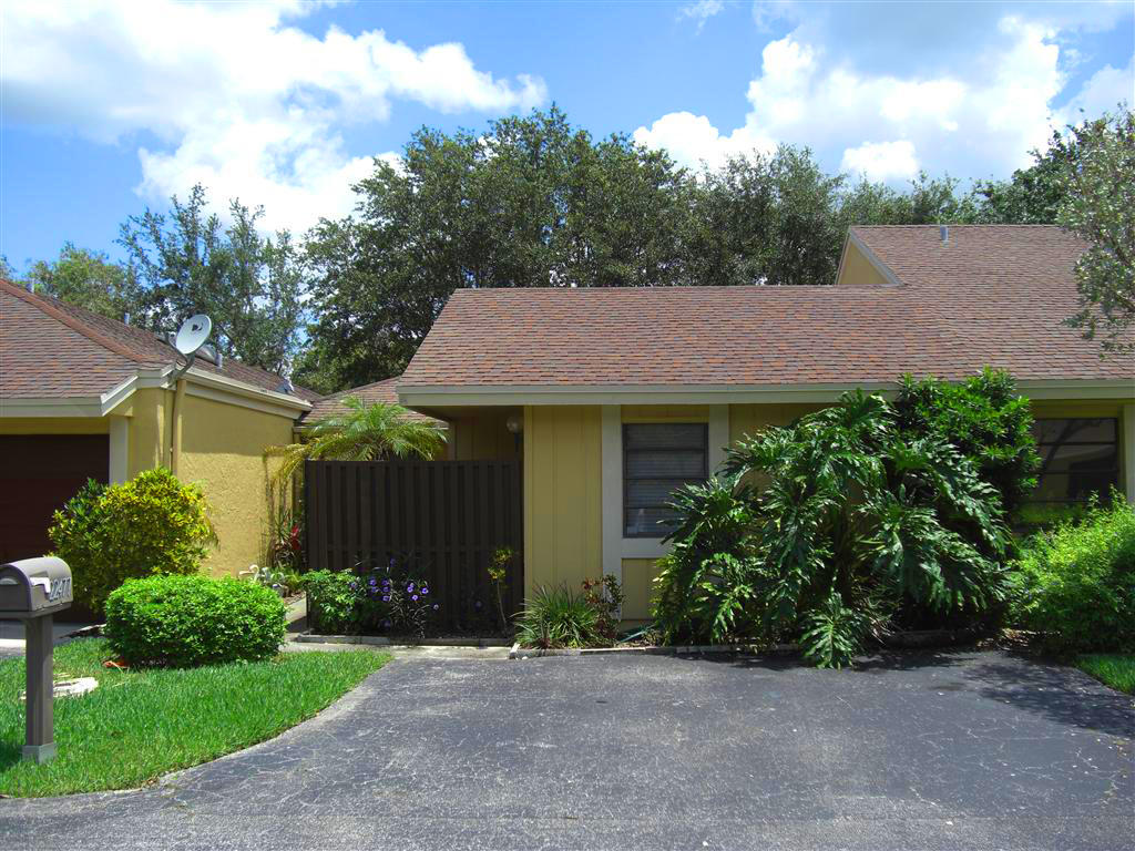 22477 Vistawood Way Boca Raton, FL 33428 - Photo 1 of 12 a view of a house with garden and plants