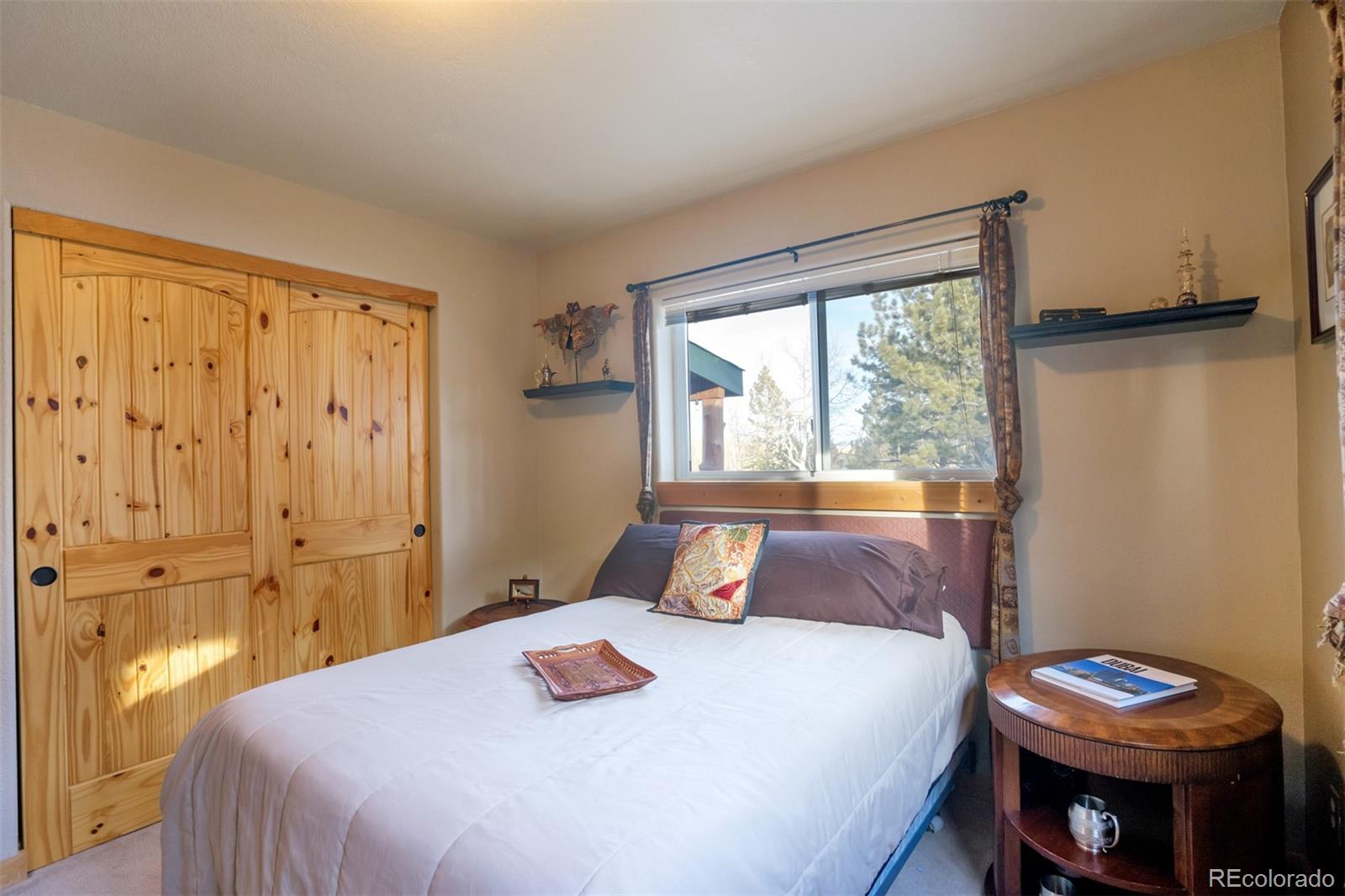 10424 Ranch Road Hartsel, CO 80449 - Photo 14 of 31 a bedroom with a bed and a window