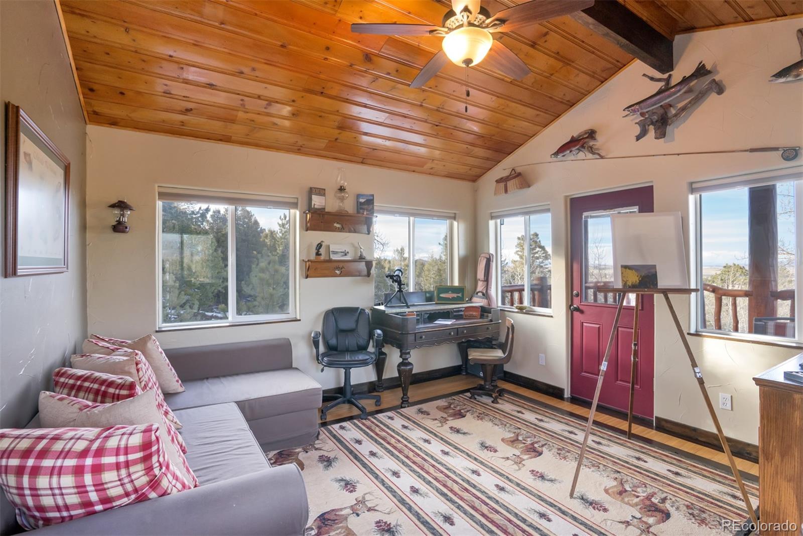 10424 Ranch Road Hartsel, CO 80449 - Photo 18 of 31 a living room with furniture and a large window