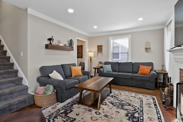 a kitchen with a refrigerator and white cabinets