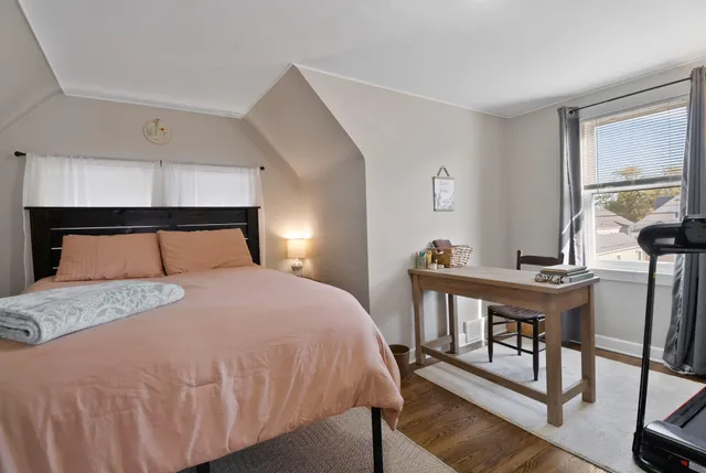 a bathroom with a toilet a sink and a window