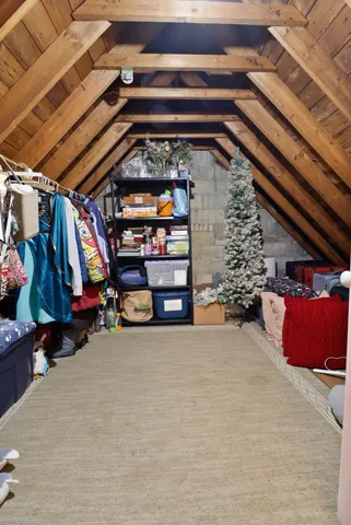 a bed room with a bed and a chair