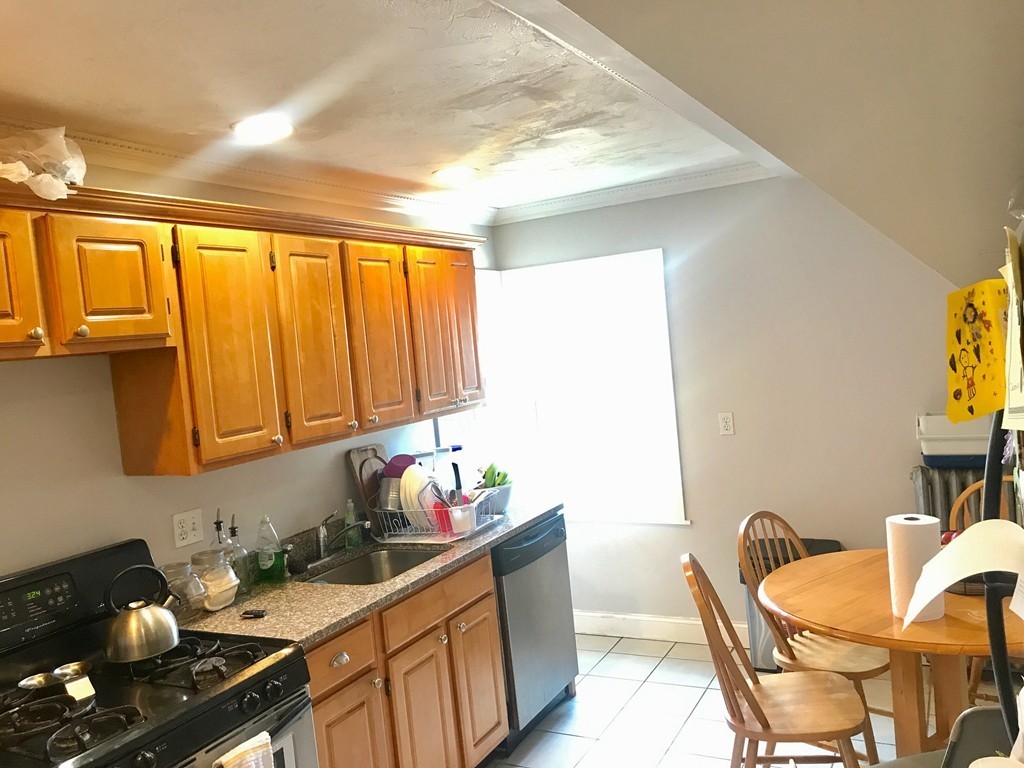 193 Hamilton Street, Unit 3 Boston, MA 02122 - Photo 2 of 8 a kitchen with a sink cabinets and appliances