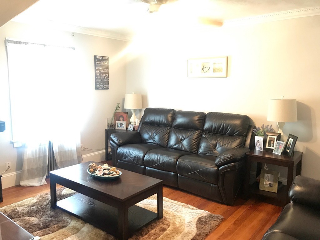 193 Hamilton Street, Unit 3 Boston, MA 02122 - Photo 3 of 8 a living room with furniture and wooden floor