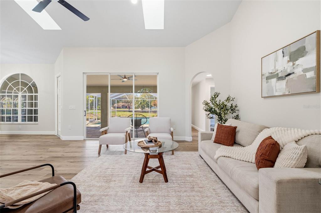 10185 Sleepy Willow Court Spring Hill, FL 34608 - Photo 11 of 44 a living room with furniture and a large window
