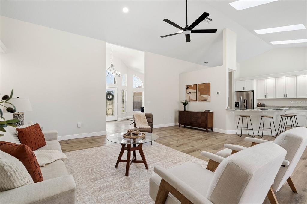 10185 Sleepy Willow Court Spring Hill, FL 34608 - Photo 14 of 44 a living room with furniture and kitchen view