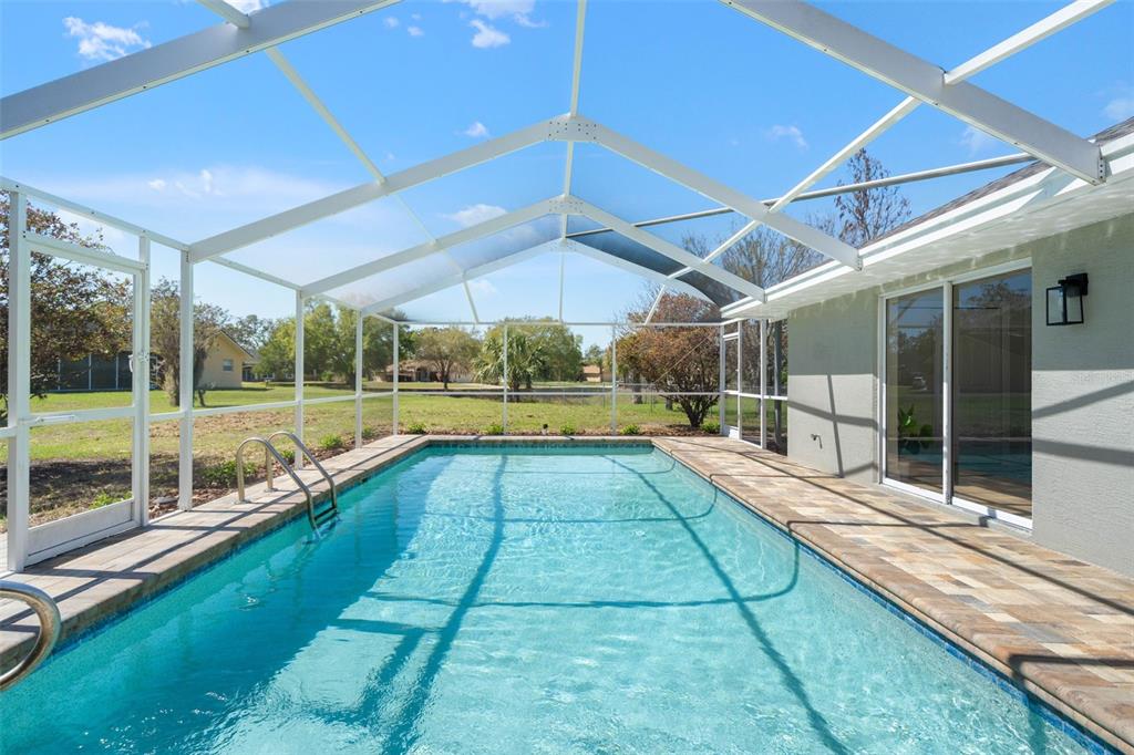 10185 Sleepy Willow Court Spring Hill, FL 34608 - Photo 3 of 44 a view of swimming pool with yard