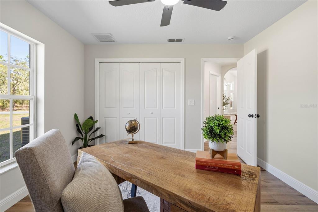 10185 Sleepy Willow Court Spring Hill, FL 34608 - Photo 33 of 44 a view of a workspace with a potted plant
