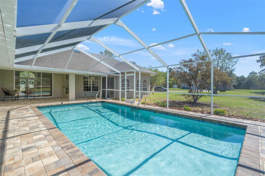 10185 Sleepy Willow Court Spring Hill, FL 34608 - Photo 38 of 44 a view of a house with a backyard