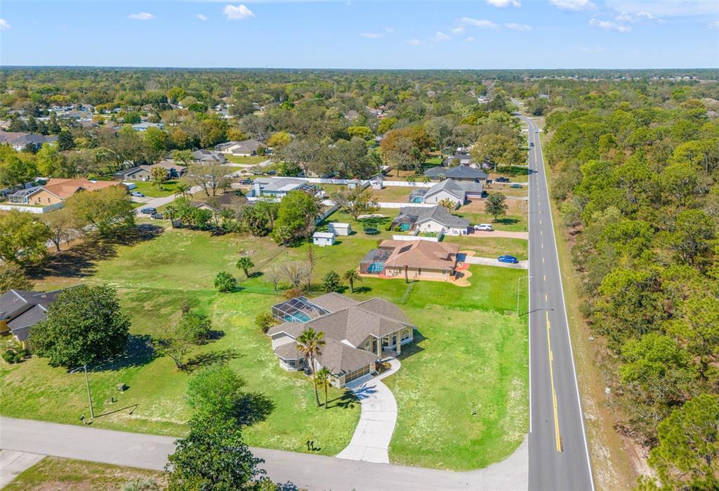 10185 Sleepy Willow Court Spring Hill, FL 34608 - Photo 4 of 44 an aerial view of residential houses with outdoor space