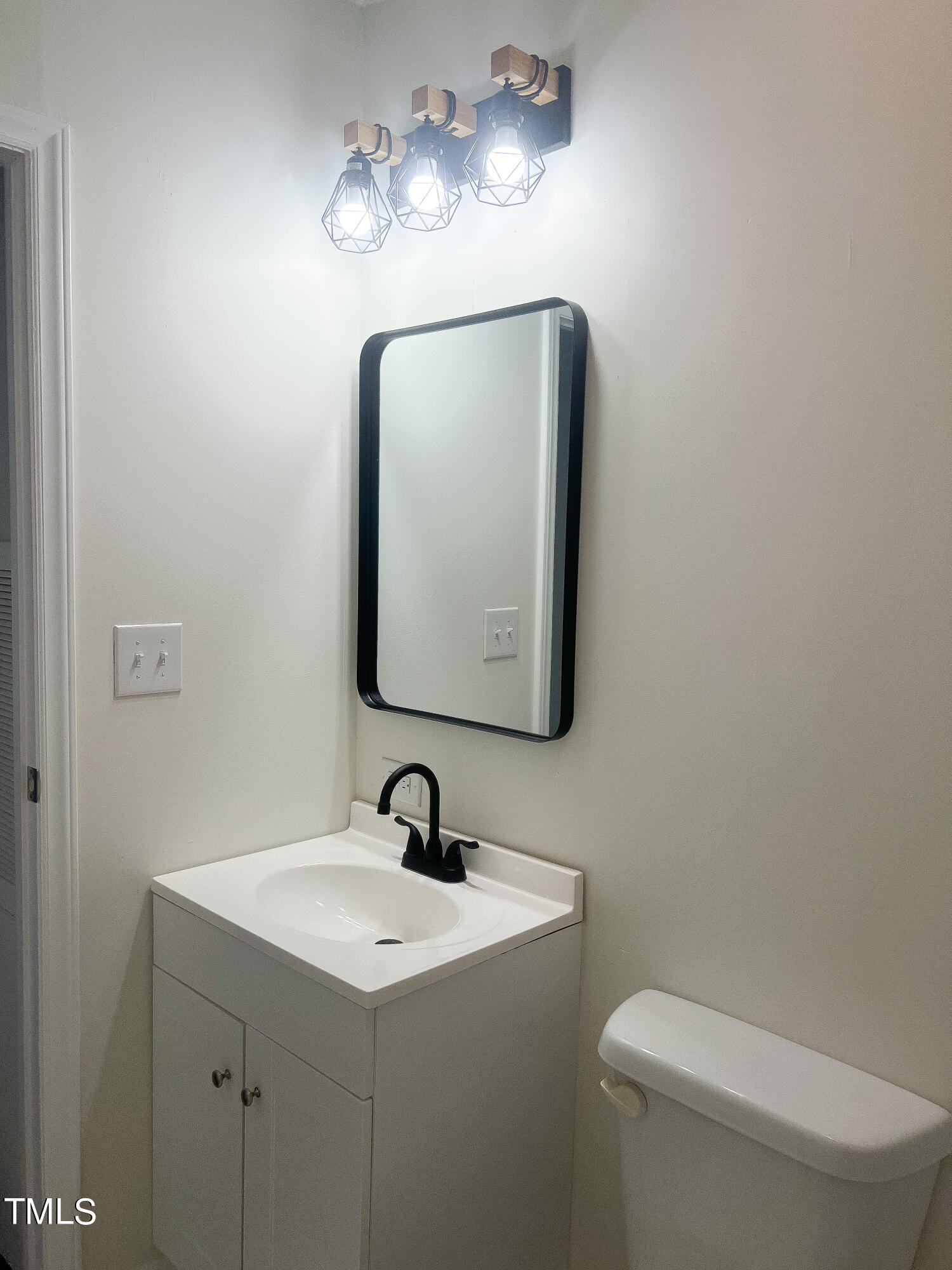 364 Moody Loop Road Siler City, NC 27344 - Photo 13 of 20 a bathroom with a toilet sink and mirror