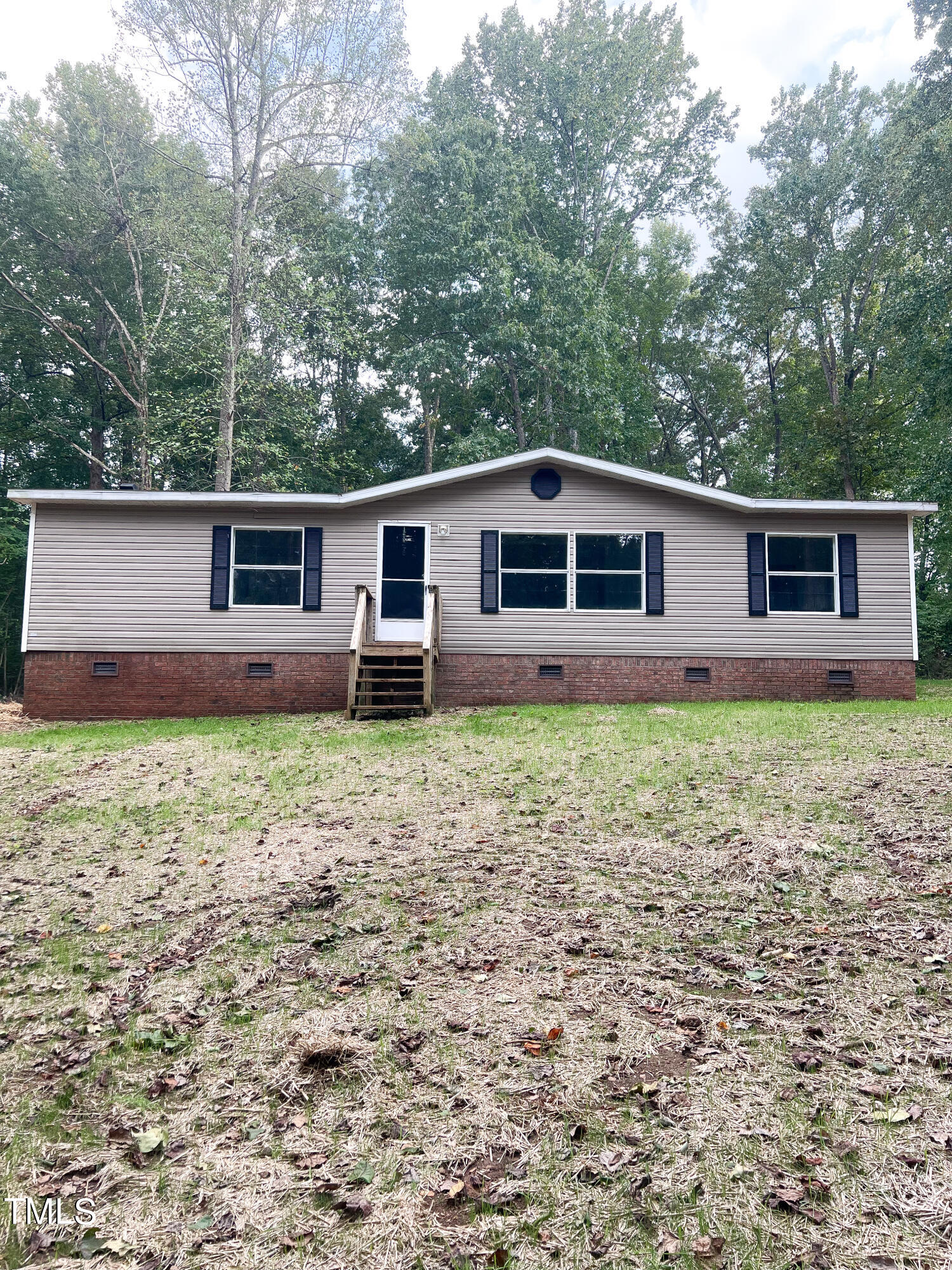 364 Moody Loop Road Siler City, NC 27344 - Photo 20 of 20 a front view of house with yard and trees around