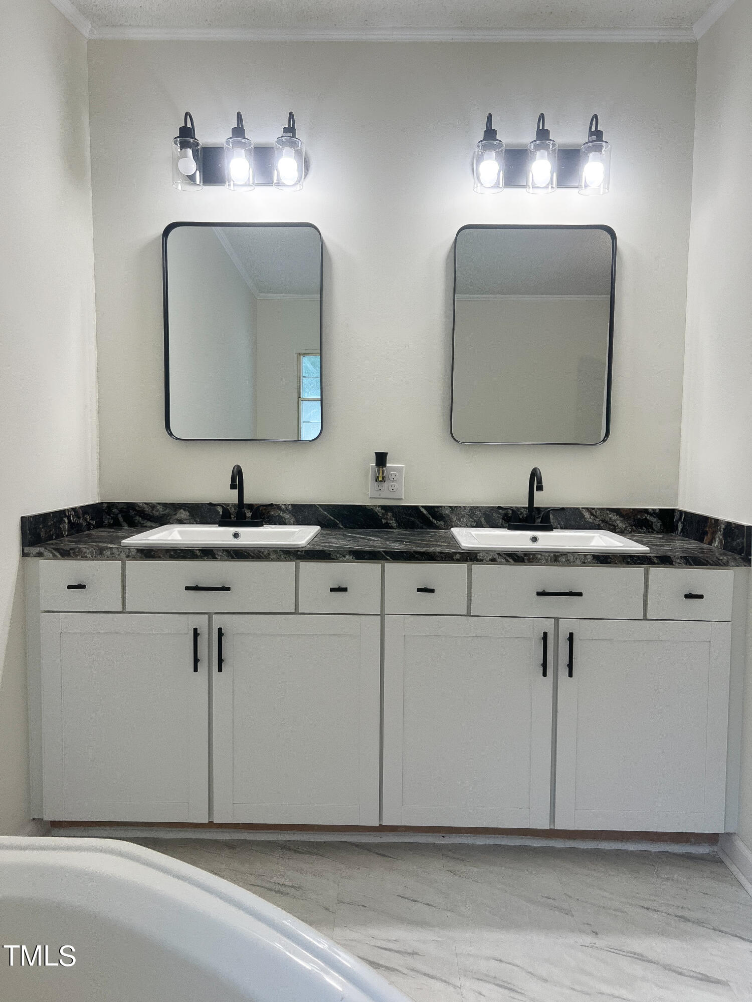 364 Moody Loop Road Siler City, NC 27344 - Photo 7 of 20 a bathroom with double vanity sinks and a mirror