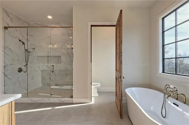 a view of hallway with wooden floor and cabinet