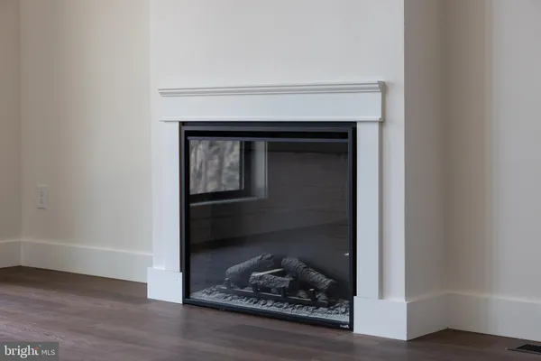 a kitchen with stainless steel appliances granite countertop a sink a stove and a wooden floors