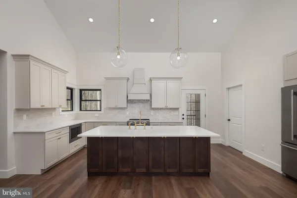 a kitchen with a sink cabinets and window