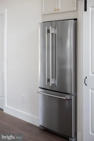 a bathroom with a granite countertop sink vanity and mirror