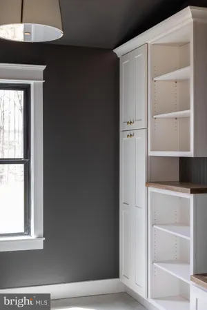 a bathroom with a shower and a sink