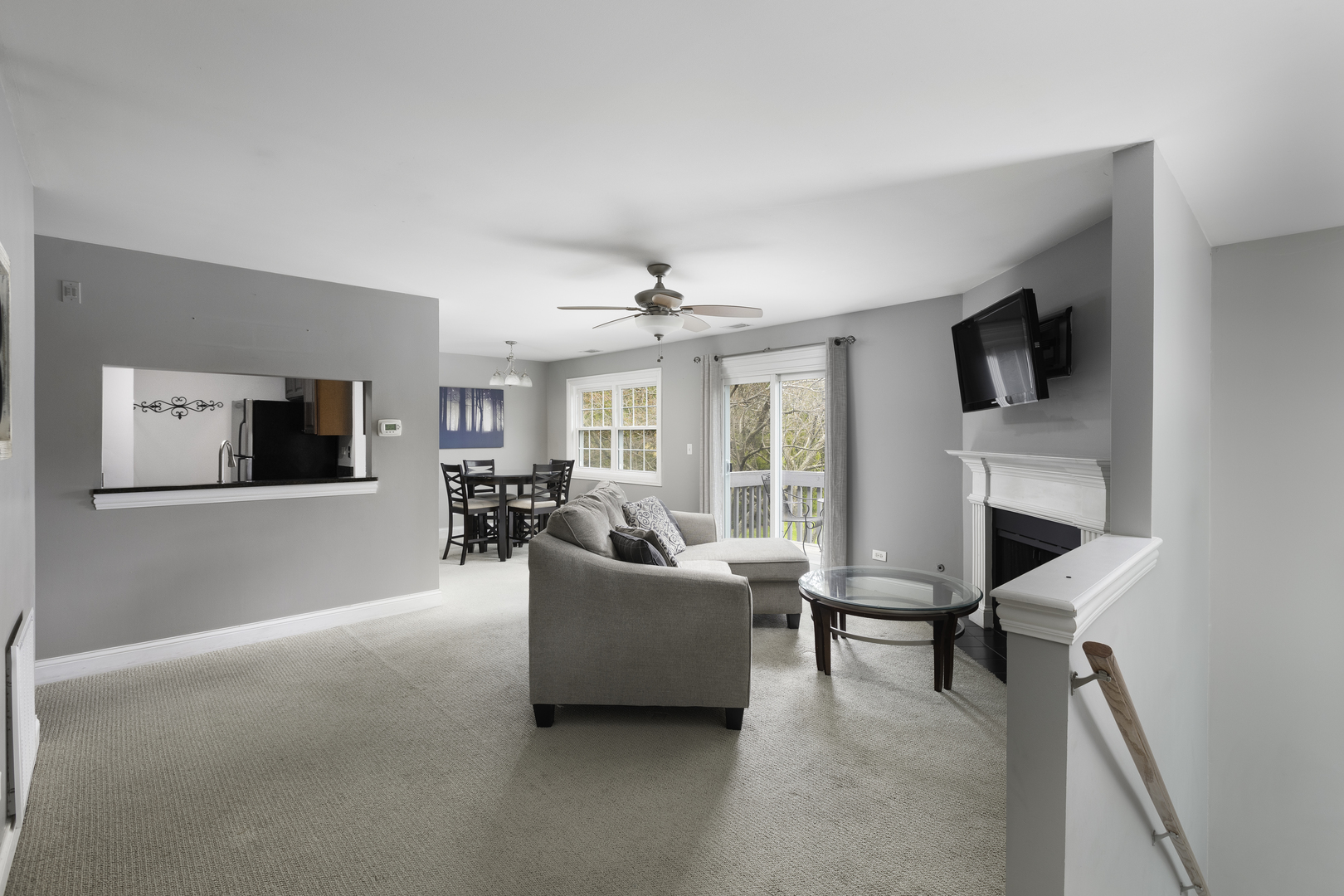 19 Foxcroft Road, Unit 203 Naperville, IL 60565 - Photo 12 of 29 a living room with furniture and a flat screen tv