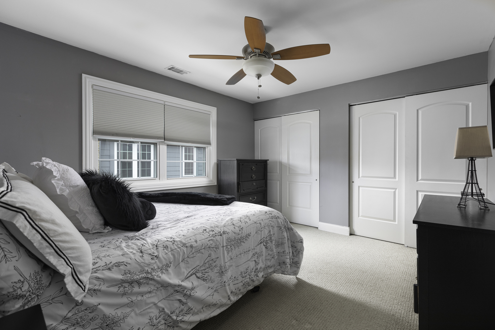 19 Foxcroft Road, Unit 203 Naperville, IL 60565 - Photo 15 of 29 a bedroom with a bed next to a window and a chandelier