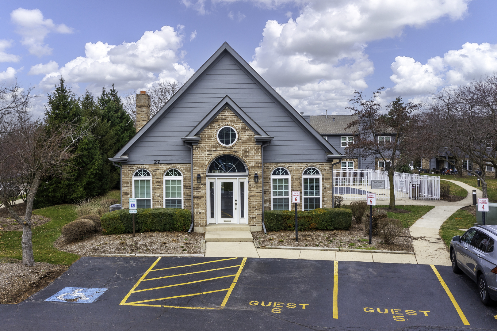 19 Foxcroft Road, Unit 203 Naperville, IL 60565 - Photo 23 of 29 a front view of a house with a yard