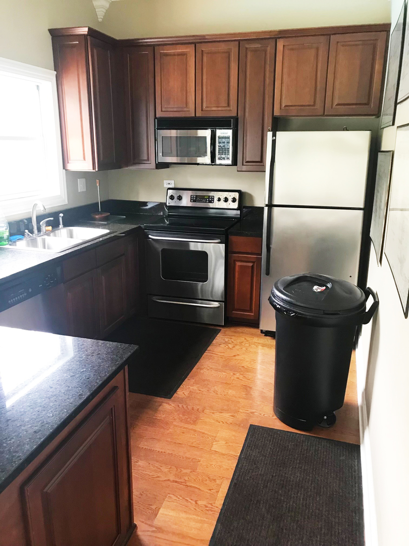 19 Foxcroft Road, Unit 203 Naperville, IL 60565 - Photo 24 of 29 a kitchen with a stove and a refrigerator