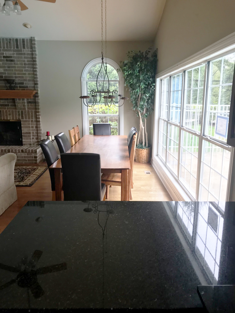 19 Foxcroft Road, Unit 203 Naperville, IL 60565 - Photo 26 of 29 a view of a dining room with furniture window and outside view