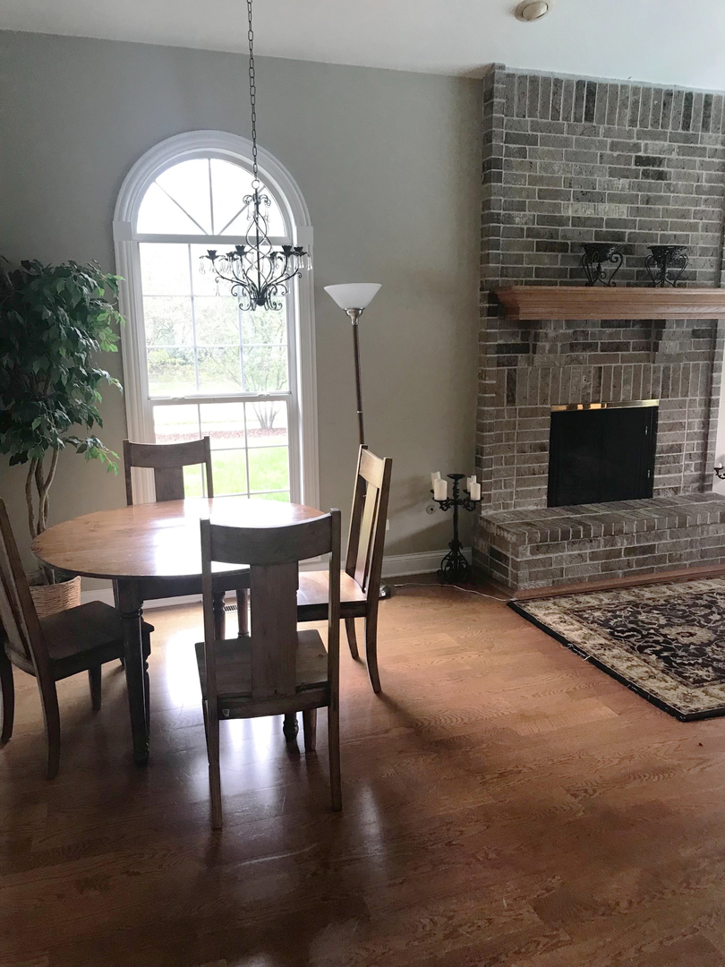 19 Foxcroft Road, Unit 203 Naperville, IL 60565 - Photo 27 of 29 a view of a dining room with furniture window and outside view