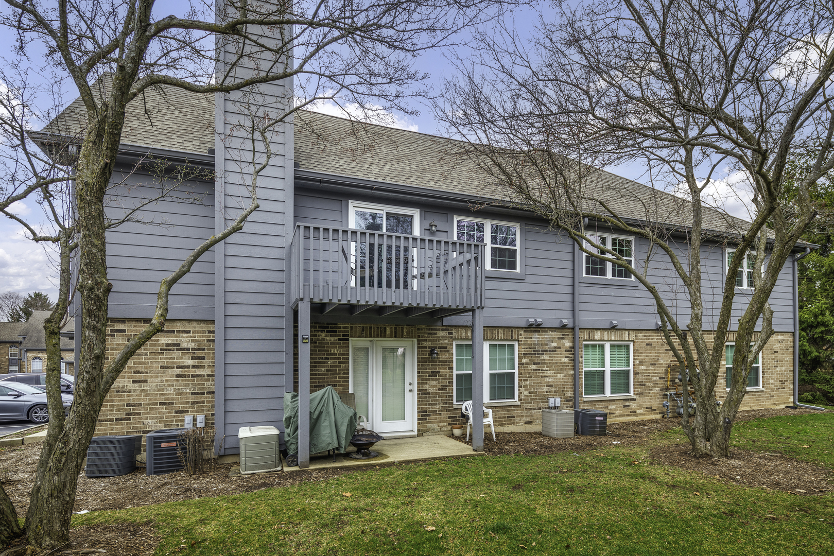 19 Foxcroft Road, Unit 203 Naperville, IL 60565 - Photo 28 of 29 a front view of a house with garden