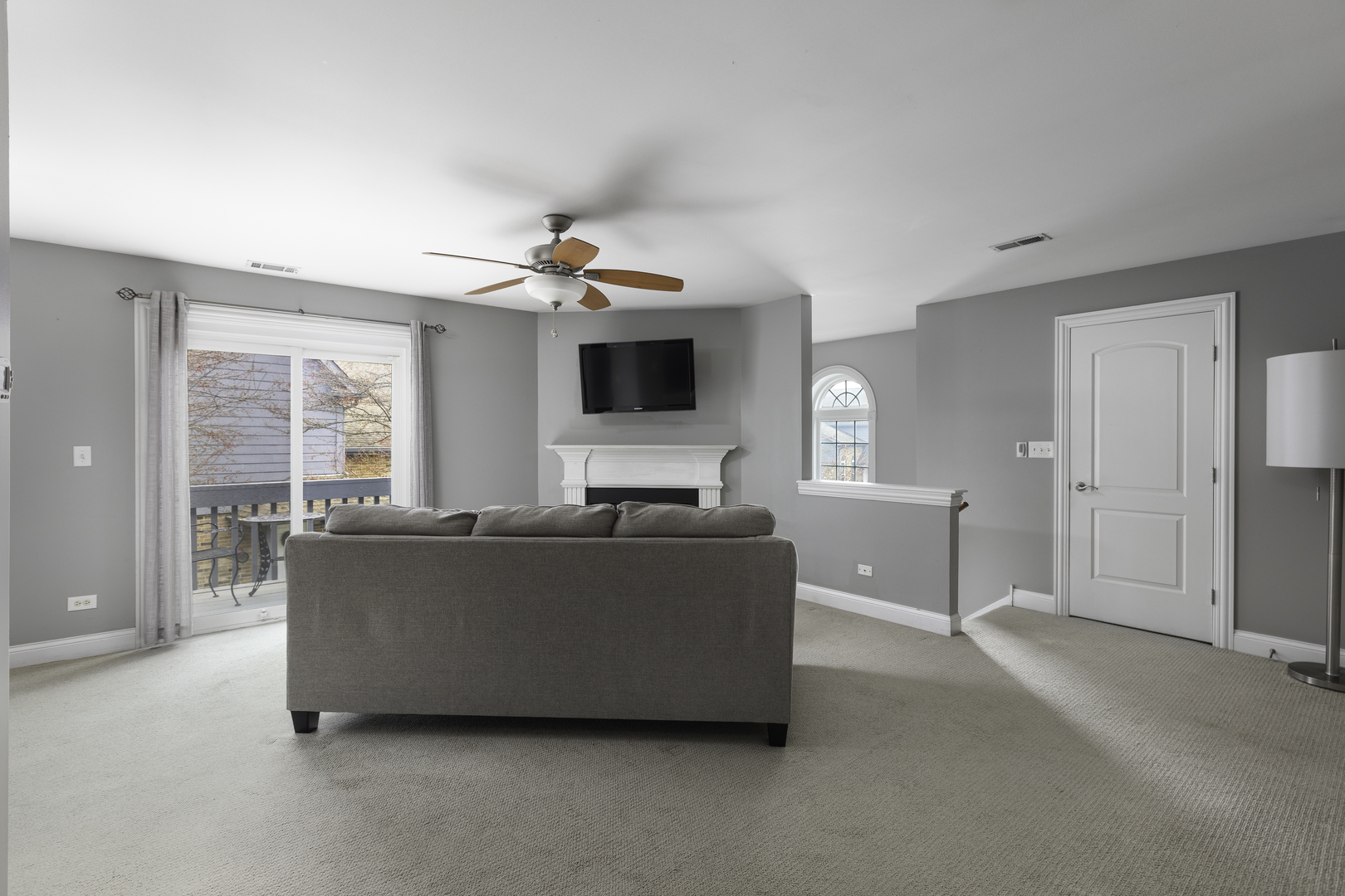 19 Foxcroft Road, Unit 203 Naperville, IL 60565 - Photo 8 of 29 a living room with furniture and a flat screen tv