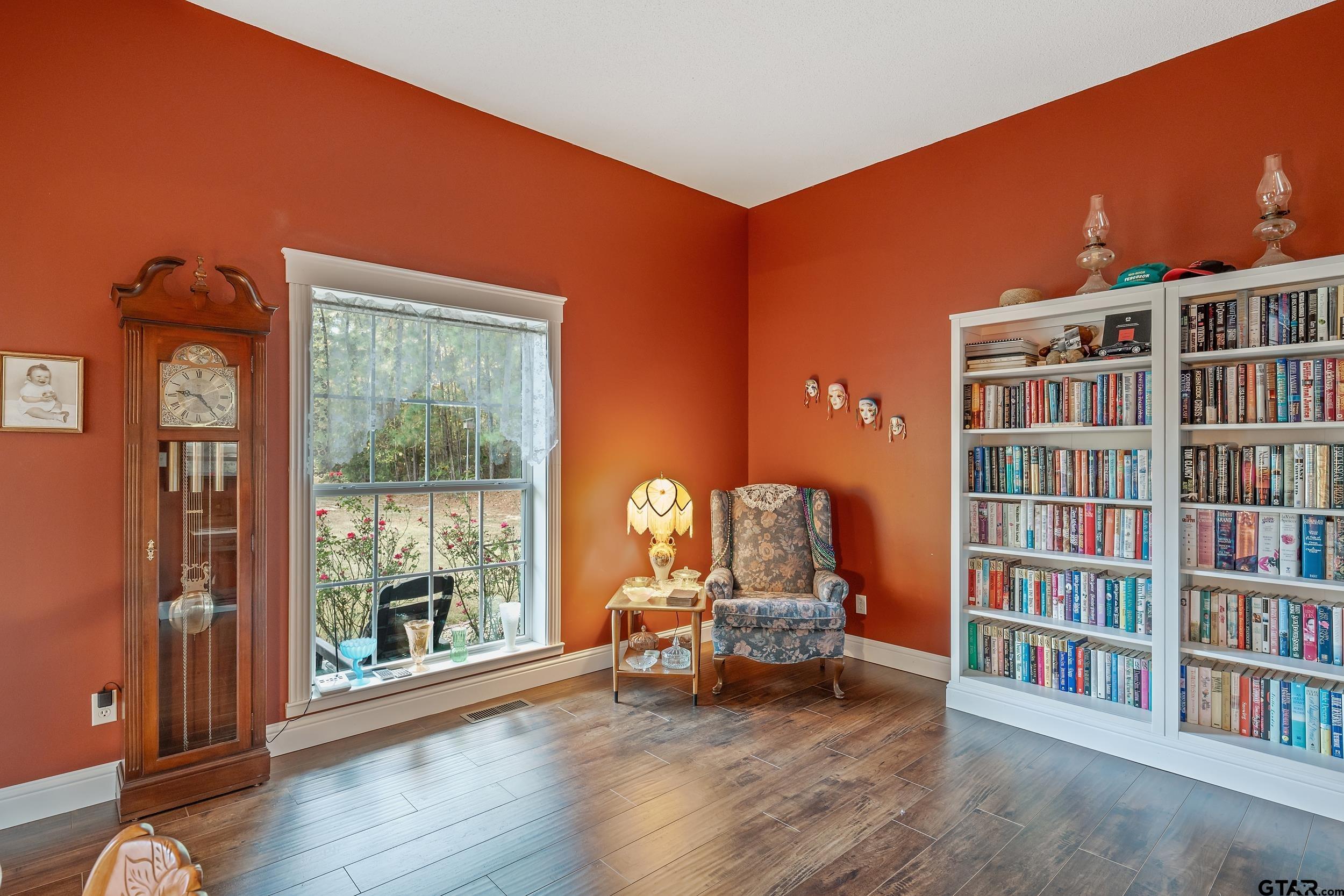 14375 County Road 384 Tyler, TX 75708 - Photo 14 of 48 a living room with furniture and a book shelf
