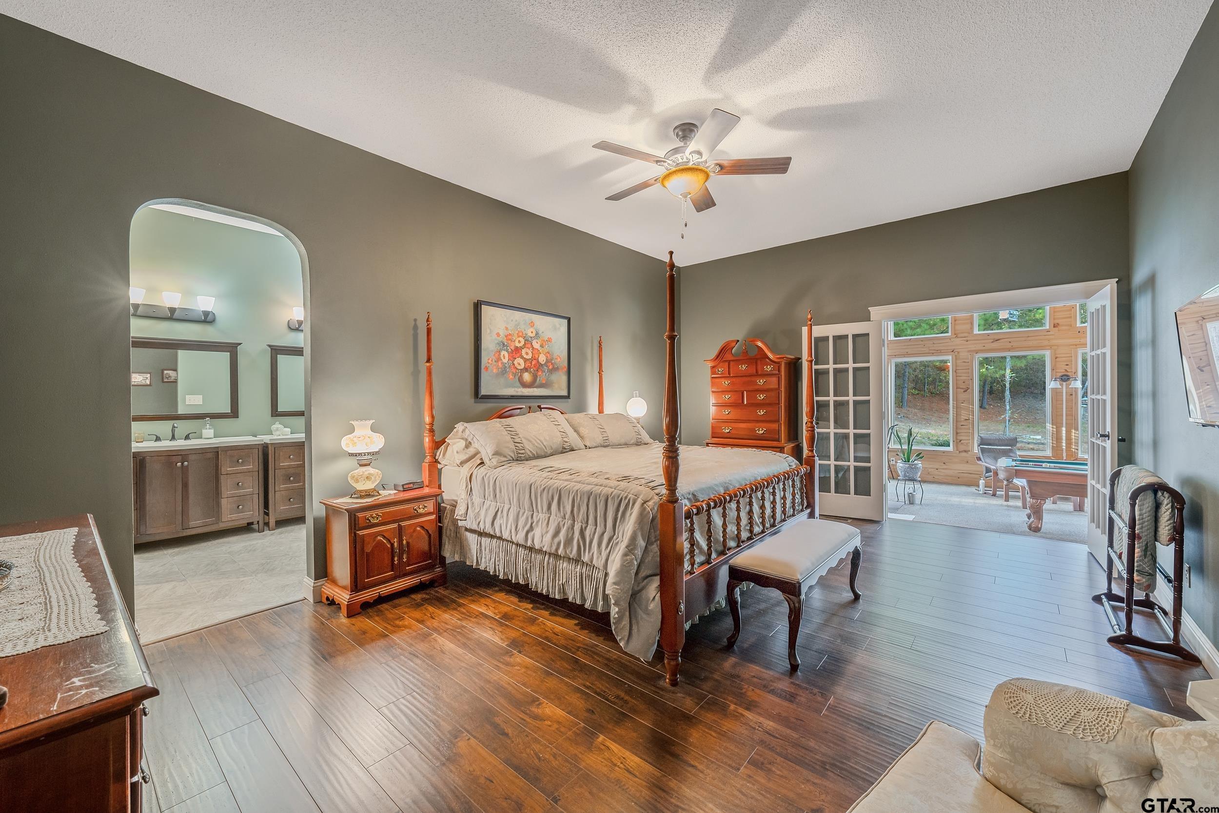 14375 County Road 384 Tyler, TX 75708 - Photo 16 of 48 a bedroom with furniture and wooden floor