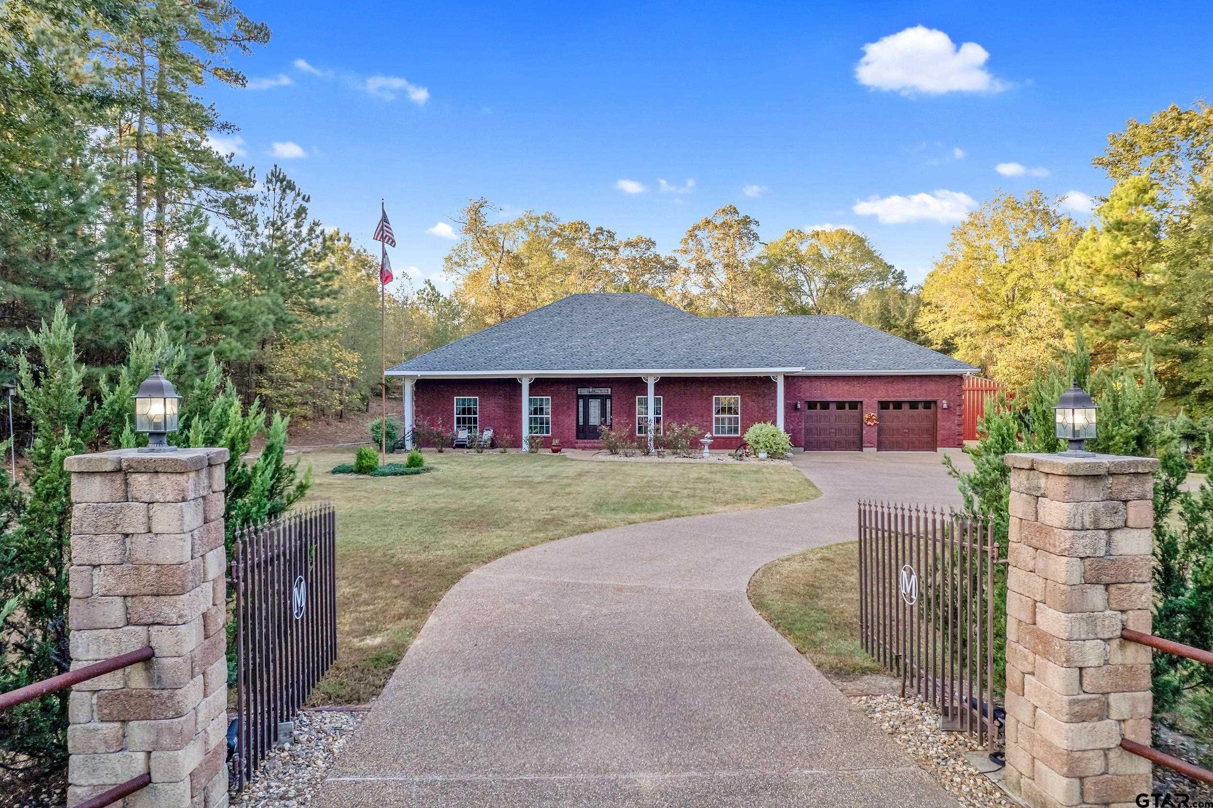 14375 County Road 384 Tyler, TX 75708 - Photo 2 of 48 a front view of a house with a yard