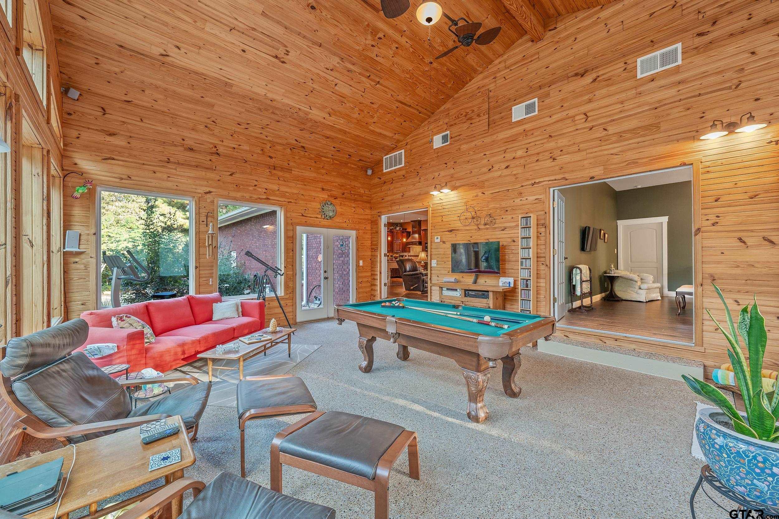 14375 County Road 384 Tyler, TX 75708 - Photo 22 of 48 a living room with furniture a table and chairs