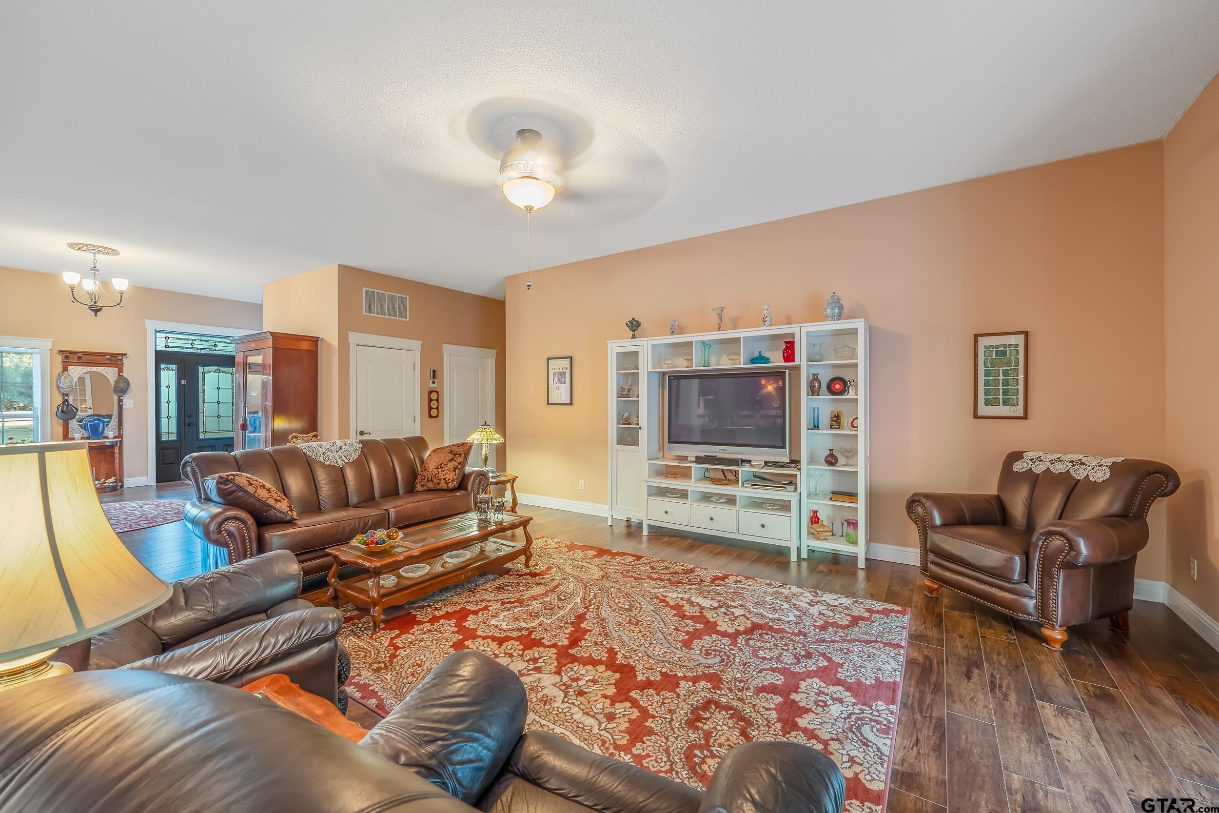 14375 County Road 384 Tyler, TX 75708 - Photo 23 of 48 a living room with furniture and a flat screen tv