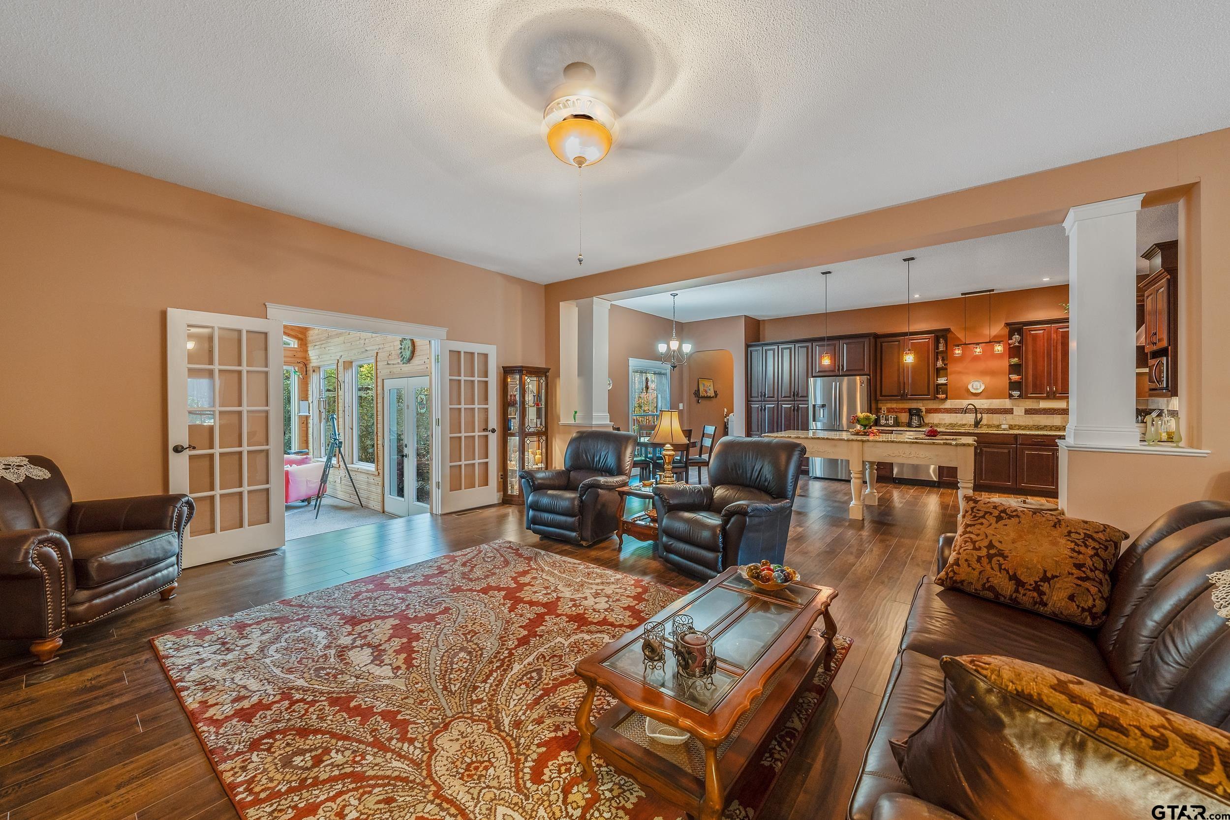 14375 County Road 384 Tyler, TX 75708 - Photo 25 of 48 a living room with furniture wooden floor and a table