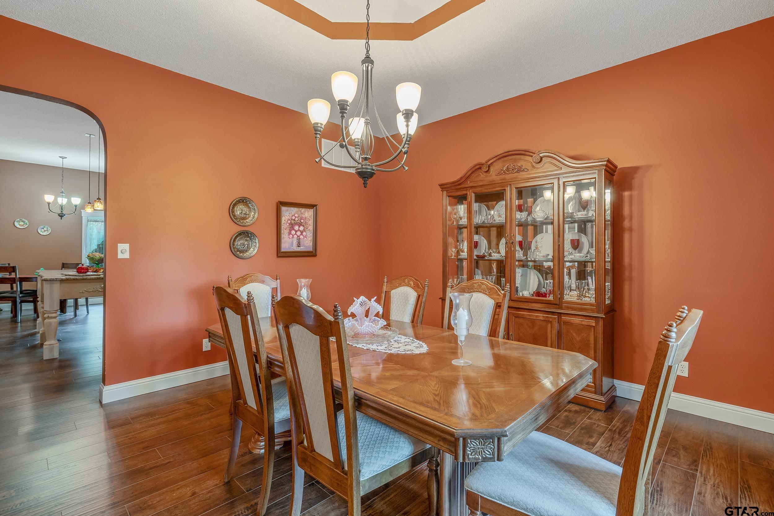 14375 County Road 384 Tyler, TX 75708 - Photo 28 of 48 a view of a dining room with furniture wooden floor and chandelier
