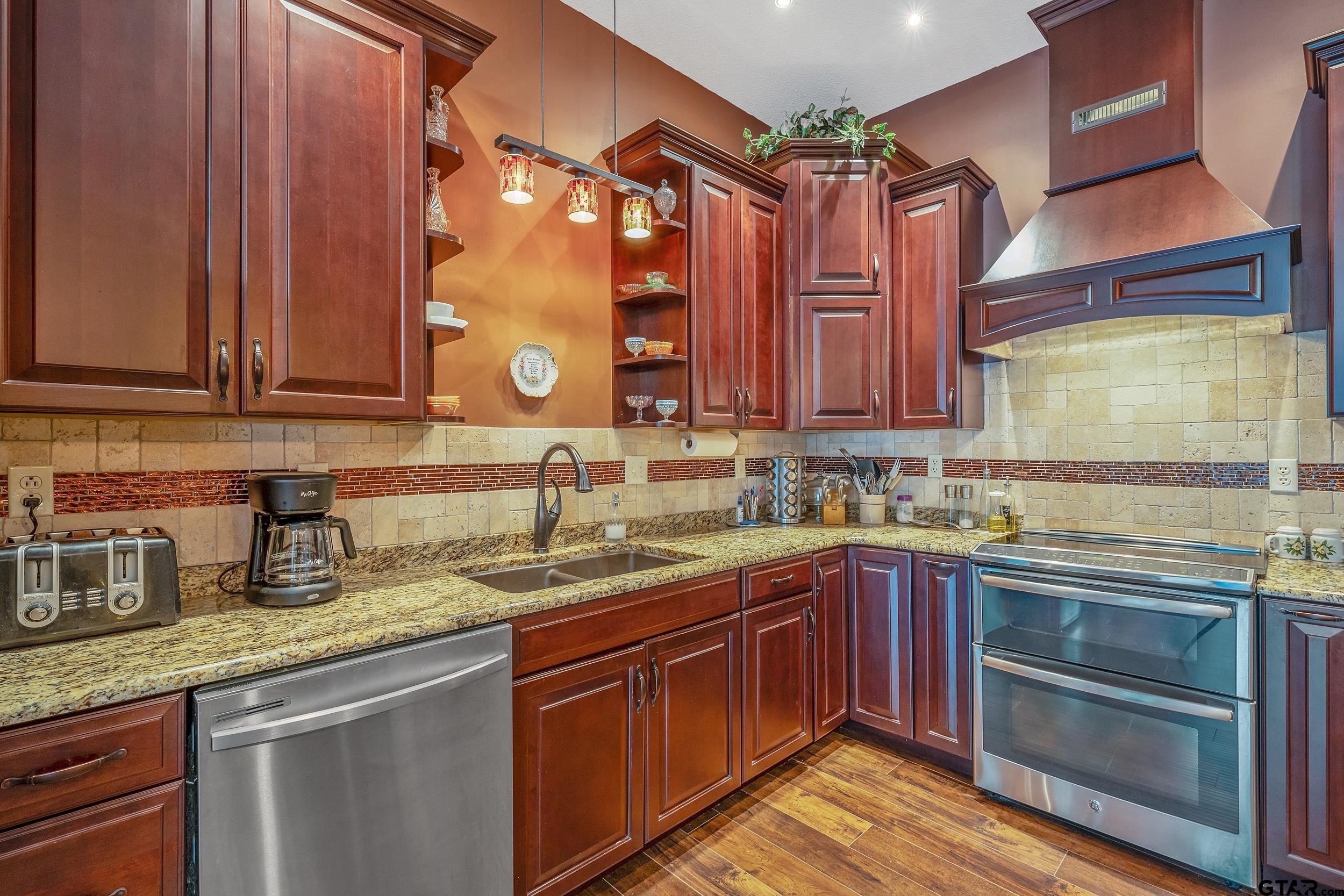 14375 County Road 384 Tyler, TX 75708 - Photo 31 of 48 a kitchen with a sink and a stove